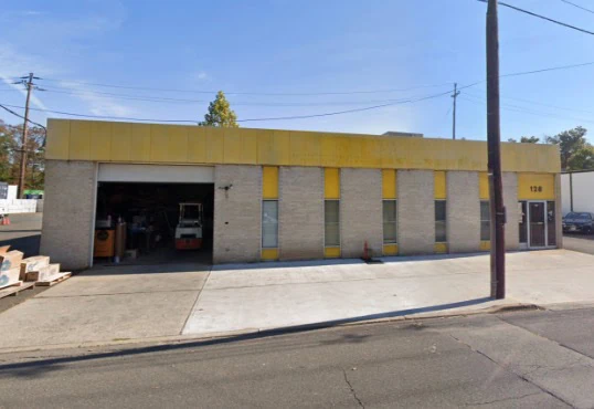 Yellow building showcasing a garage door